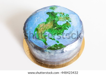 The original hand painted cake with a picture of North American continent, the planet Earth