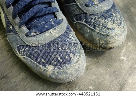Dirty shoe - sneakers on mud