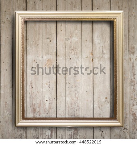 Picture frame on wooden wall. for your design