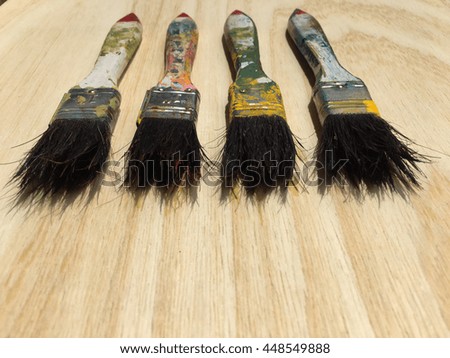 Paint brush on a wood background