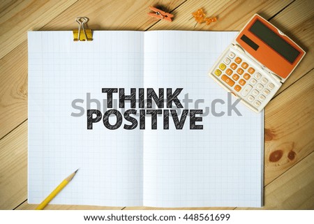 THINK POSITIVE text on paper in the office , business concept