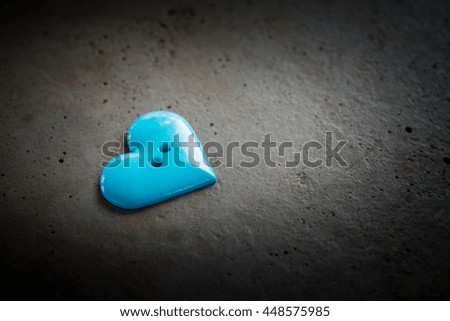 Valentines Day background with heart ,Heart shape of plastic stud on concrete with vignette