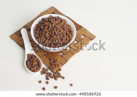 Brown Chana in a bowl isolated on white background with spoon and table mat   Royalty-Free Stock Photo #448586926
