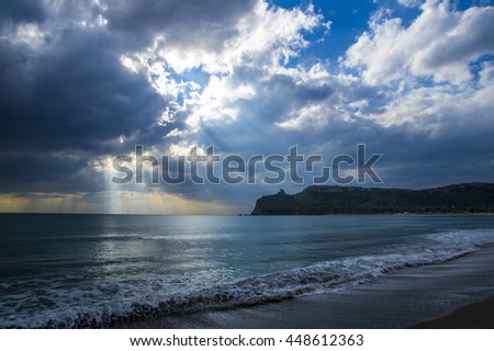 Panoramic photo of the sea with cloudy sky and the saddle of the devil as a background