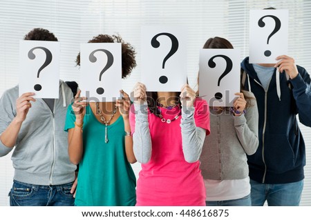 Students Hiding There Face With Question Mark Sign, uncertainty of their future concept
