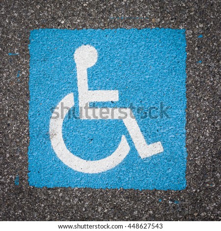 International handicapped symbol painted in bright blue