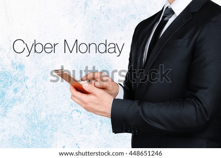 businessman using mobile smart phone near text - cyber monday