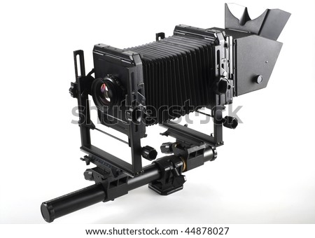 Large format camera front taken from the side.