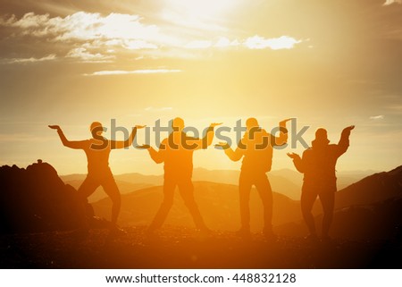 Group of happy friends having fun on sunset background