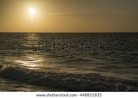 sunset in the Caribbean with the sun in picture