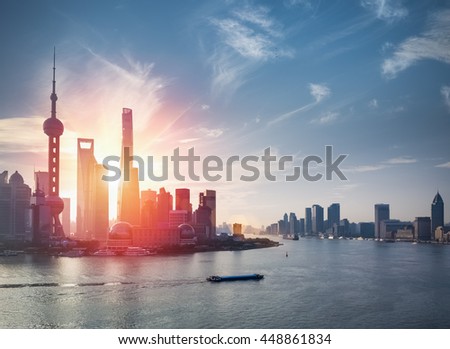 shanghai skyline against a blue sky with beautiful huangpu river
