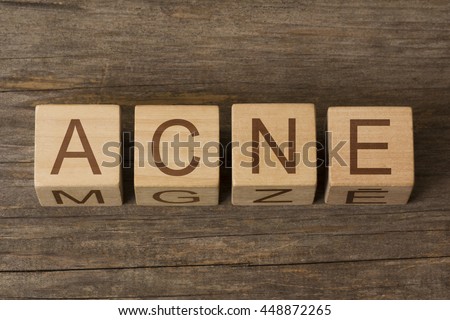 acne word in vintage wooden blocks