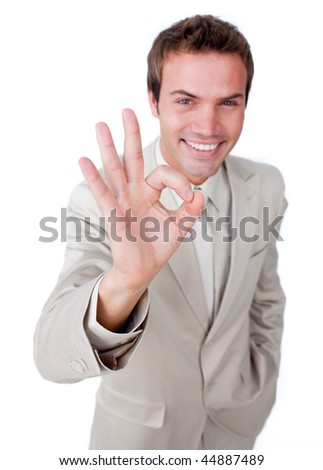 Charismatic businessman showing OK sign against a white background