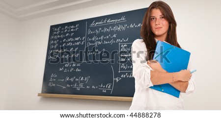Portrait of a girl with a blackboard with formulae as background