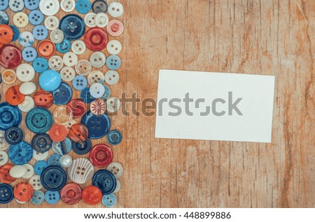 Various buttons composition, wooden background, vintage paper background, mock up