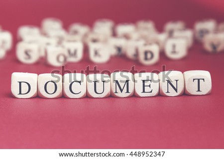 Document word written on wood cube with red background