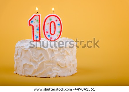 10 candles on a birthday cake for tenth birthday.  10th Birthday Cake Royalty-Free Stock Photo #449041561