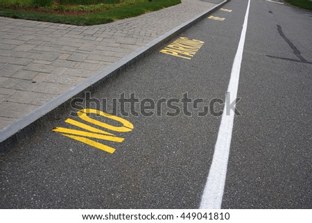 No parking lane with text sign on the street surface