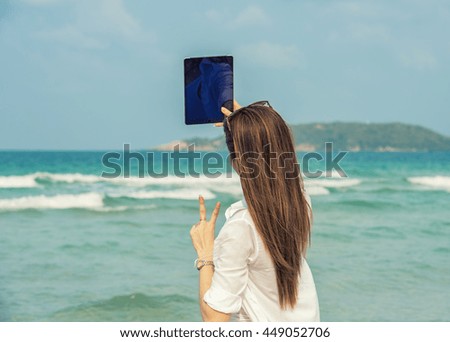 Selfie girl at the beach.