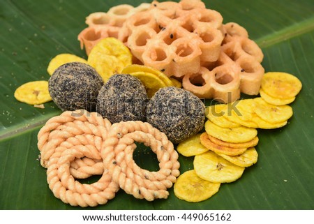 Banana chips, rice balls, popular traditional sweet and savoury  tea time snack of Kerala India made of flour, deep fried in coconut oil on Onam, Vishu, Ramadan festivals. crunchy South Indian food.