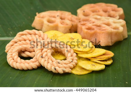 Banana chips, rice balls, popular traditional sweet and savoury  tea time snack of Kerala India made of flour, deep fried in coconut oil on Onam, Vishu, Ramadan festivals. crunchy South Indian food.