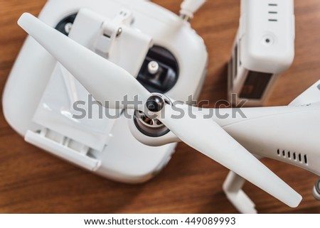 White Drone on wooden background
