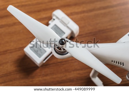 White Drone on wooden background