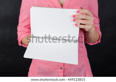 Young woman in pink shirt working