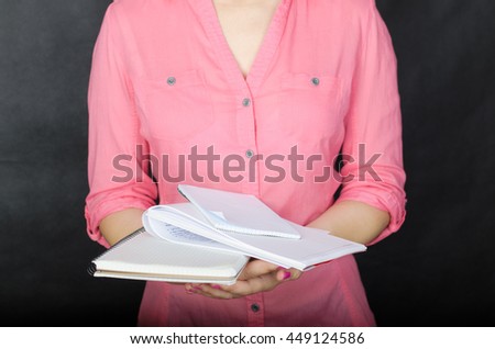 Young woman in pink shirt working