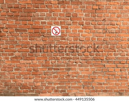 Brickwork with "No smoking" sign