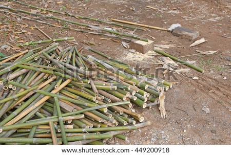 Pile of cut bamboo put on floor.