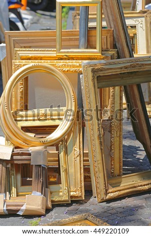 Empty Rustic Gold Picture Frames at Flea Market