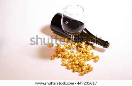 Picture of a wine glass with popcorn