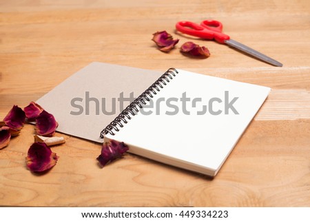 Note book on wooden background - vintage effect style picture