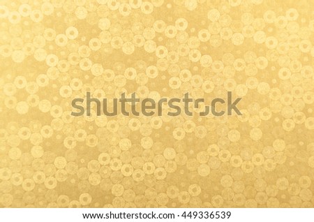 Glittery and textured golden metallic paper background