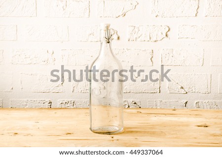 Glass background white wall on a wood floor.