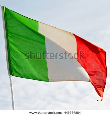 waving flag in the blue sky italy   colour and wave