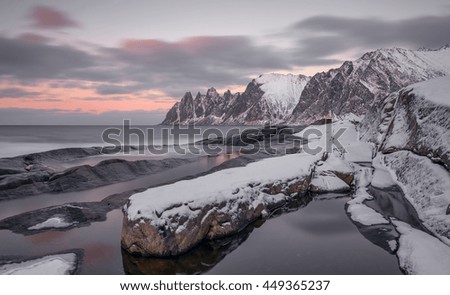 Winter panoramic view to Steinfjord on Senja island at sunset - Troms county, Norway (long exposure).