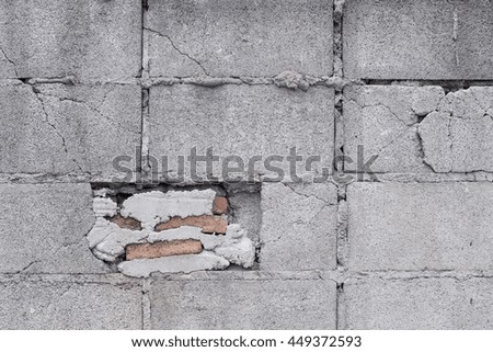 Flat grey concrete wall and red brick background