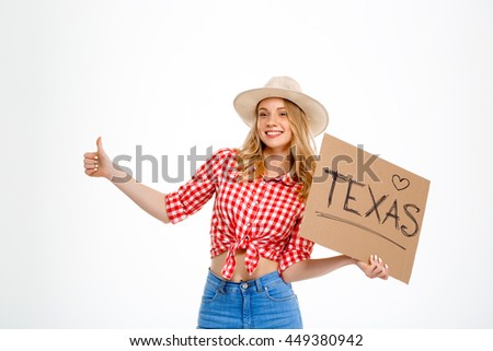 Portrait of beautiful country girl hitchhiking over white background.