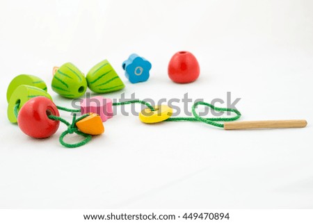 Colorful wooden beads toy on white background