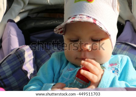 Small baby outdoor in a summer day