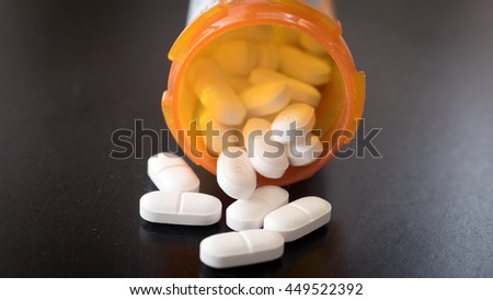 Prescription drugs spilled out on a table