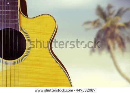 Acoustic guitar on beach.Filtered image processed vintage effect.