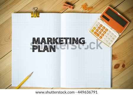 MARKETING PLAN text on paper in the office , business concept
