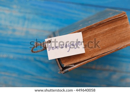 Reading concept, Top Viewed vintage book with a sign - travel