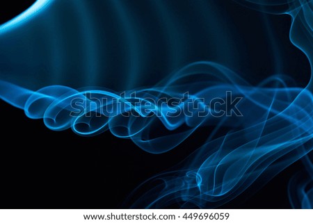 blue curly smoke lines isolated on black