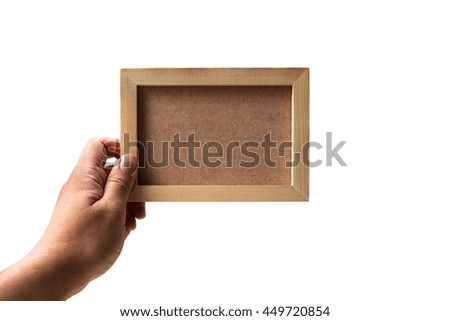 Hold the blank wooden picture frame; Isolated 