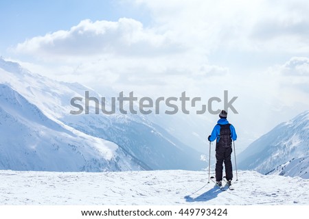 skiing background, skier in beautiful mountain landscape, winter holidays in Alps