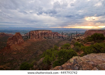 Storm clouds over the Colorado National Monument at sunrise in the city of Grand Junction, Colorado